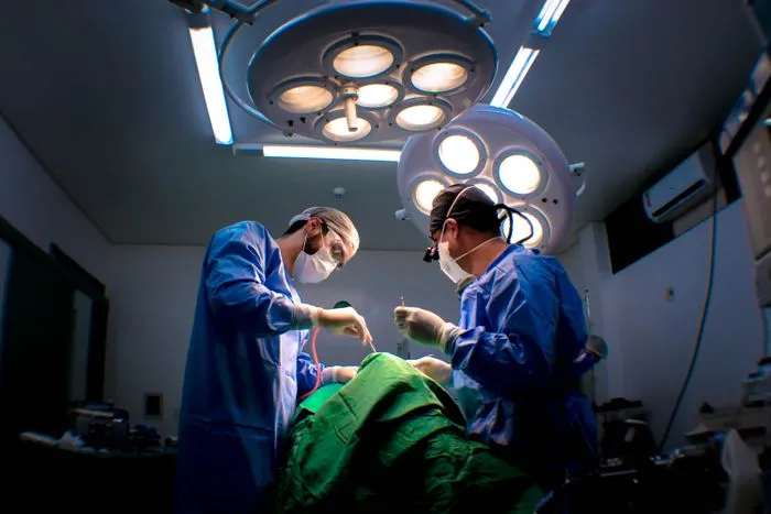 Surgeons performing laparoscopic gynecological surgery