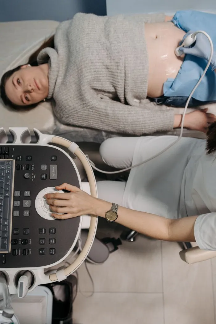 Pregnant woman reviewing her prenatal care plan and next scan dates